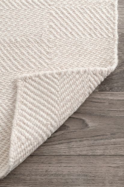 Material & finish flat-lay — terrazzo, oak, moss carpet and brass